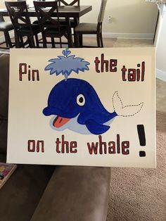 a sign that says pin the tail on the whale