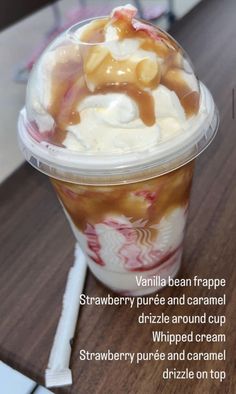 an ice cream sundae with caramel syrup and whipped cream in a plastic cup