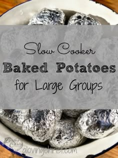 baked potatoes in a bowl with text overlay that reads slow cooker baked potatoes for large groups