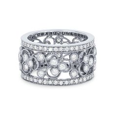 a white gold ring with diamonds on the sides and an intricate design in the middle