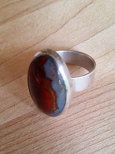 Vintage handcrafted sterling silver and red jasper cabachon ring STONE Length: 25.30mm Width: 16.30mm Thickness: 6.24mm Setting: Bezel RING Size: 7.5 Band Width: 6.03mm Vintage Material: sterling silver Gemstone: Red jasper All sales are final with no returns or exchanges. ✨️✨️✨️SALE 30-40% OFF---1/23-2/6!✨️✨️✨️ 🎊🎊Feel free to check out my other shop-----ACAbstractDesigns----- for more great items 🚛Shipping🚛 Same day shipping available for purchases made before 10:00 PM Central Time.  Orders Handmade Oval Ruby Ring In Sterling Silver, Red Round Sterling Silver Gemstones, Red Oval Sterling Silver Crystal Ring, Red Sterling Silver Oval Cabochon Ring, Bluish Gray, Jasper Ring, Bezel Ring, Red Jasper, Wide Bands