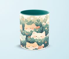 a mug with cats on it sitting in the bushes