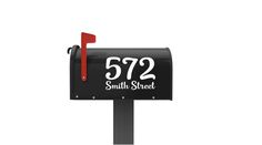 a black mailbox with the number 372 on it's front and side