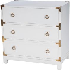 a white and gold chest of drawers with two handles on each side, one drawer closed