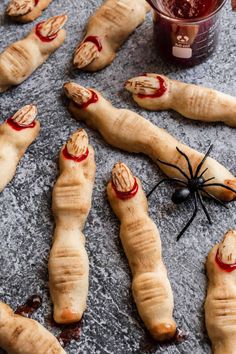 several croissants with blood on them and a jar of jam in the background