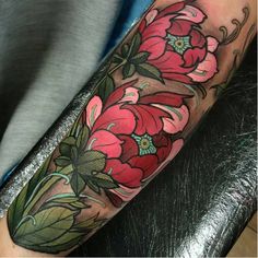 a person with a flower tattoo on their arm