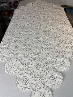 the table is covered with white crocheted doily