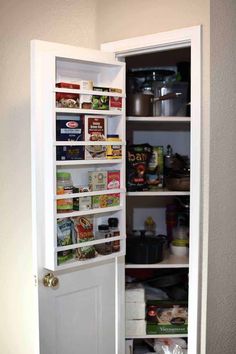 an open pantry door with food in it