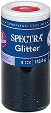 a jar of spectra glitter sitting on top of a table