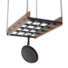 a pot and pan hanging from a metal rack