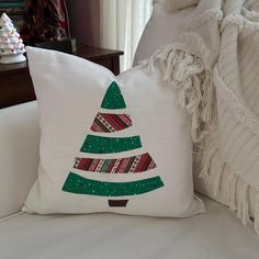 a pillow with a christmas tree on it