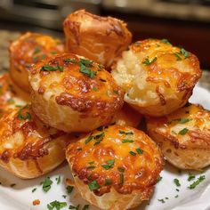 small baked goods on a white plate with parsley