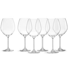 six wine glasses are lined up in a row