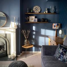 a living room filled with furniture and a fire place