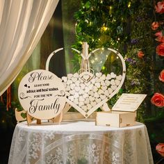 a table topped with two heart shaped wooden signs