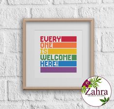 a cross stitch pattern with the words'every one is welcome here'in rainbow colors