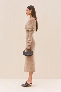 A midi-length, off the shoulder knit dress with ribbing details. — Midi length — Meant to be worn off the shoulder — Ribbed knit details — Body hugging silhouette Off The Shoulder Knit, Hugging Silhouette, Swimming Bag, Candle Collection, Kids Sandals, Cozy Fall, Beach Dresses, Leather Jewelry, Kids' Dresses