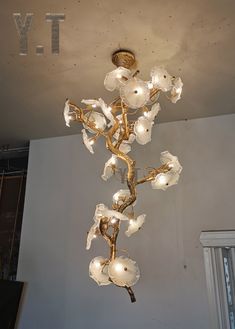 a chandelier hanging from the ceiling in a room