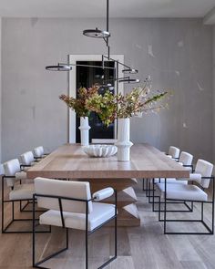 the instagram page shows an image of a dining table with chairs and vases on it