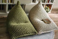 two knitted bean bags sitting on top of a wooden floor