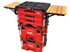 a red tool cart with two wooden boards on top