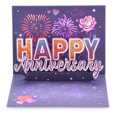 a happy anniversary card with fireworks and flowers on the front, in purple hues