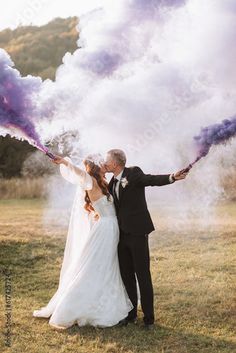 Stock Image: bride and groom playing with colored smoke in purple hands, hugs and kisses. Smoke bombs at a wedding. Crazy Wedding Photos, Bride Shots, Street Wedding, Wedding Extras, Crazy Wedding, Make Lemonade, Bride Photoshoot, Water Wedding, Boho Wedding Inspiration