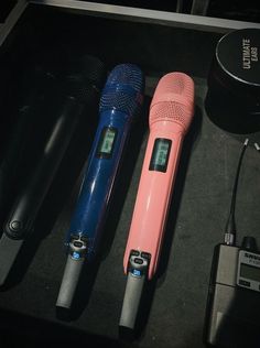 there are three different types of microphones on the table next to eachother