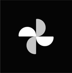 the letter k is made up of two overlapping shapes in white and grey on a black background