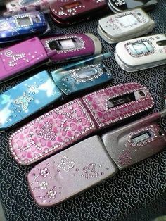 there are many cell phones that have been decorated with swaroes and jewels on them