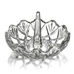 a glass bowl that is shaped like a lotus flower and has leaves on the bottom