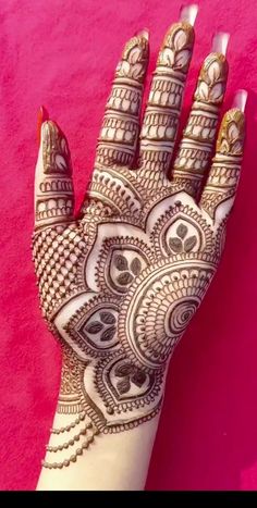 henna tattoo on the palm of a woman's hand