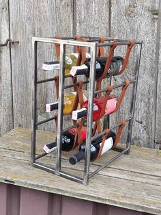 a metal wine rack filled with lots of bottles