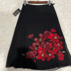 Aline Skirt Double Layer One Layer Underneath With Flowers And On Top As Well.Deep Red /Burgundy Color Flowers. Red Formal Skirt For Summer, Red Flowy Skirt For Formal Occasions, Formal Red Flowy Skirt, Red Formal Flowy Skirt, Red A-line Skirt For Formal Occasions, Red Flowy Formal Skirt, Formal Red A-line Skirt, Black Embroidered Long Skirt, Bohemian Embroidered Red Skirt