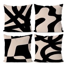 four pillows with black and white designs on the front, one is square and two are rectangleed