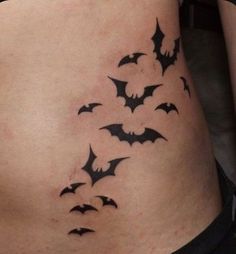 a woman's stomach with bats on it and the bottom part of her body