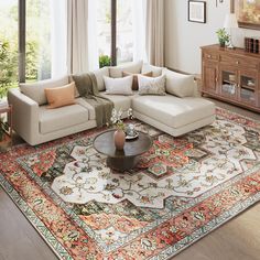 a living room filled with furniture and lots of windows