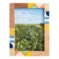 an image of a tropical scene in a wooden frame