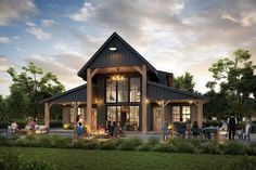 a group of people sitting around a fire pit in front of a house