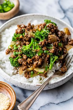 a white bowl filled with rice and ground beef