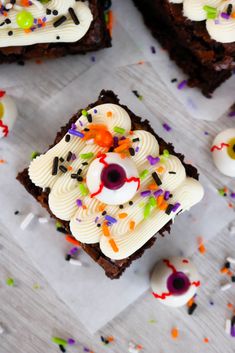 halloween brownies with white frosting, sprinkles and eyes on them