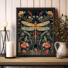 a dragonfly sitting on top of a wooden table next to a vase and candle