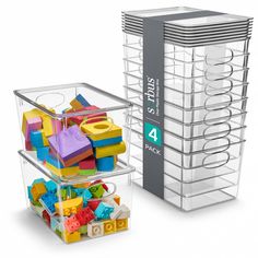 stacking bins filled with toys and building blocks on top of each other in front of a white background