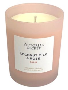 a pink candle with a label that says victoria's secret coconut milk and rose