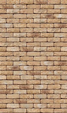 a brown brick wall textured with natural stone