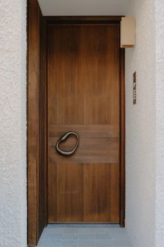 a wooden door with a metal handle on it