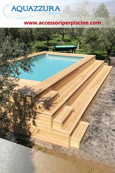 an above ground swimming pool with steps leading up to it and trees in the background