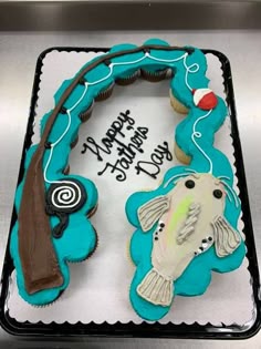 a birthday cake decorated with fishing related items