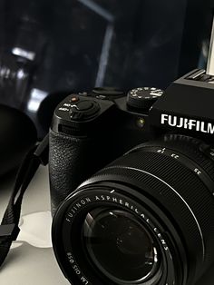 a black camera sitting on top of a table