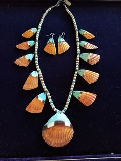 Vintage Santo Domingo Pueblo handmade Spondyus Shell necklace and earrings set, overlaid with turquoise and shell. Thus is 24" long.  The center shell is 2.45"wide. Traditional Handmade Shell Necklace For Festival, Handmade Shell-shaped Beaded Necklace For Festival, Native American Shell Jewelry, Niihau Shells Necklaces, Cowrie Shell-shaped Necklace For Festivals, Florida Jewelry, Seminole Indians, Necklace And Earrings Set, Shell Necklace